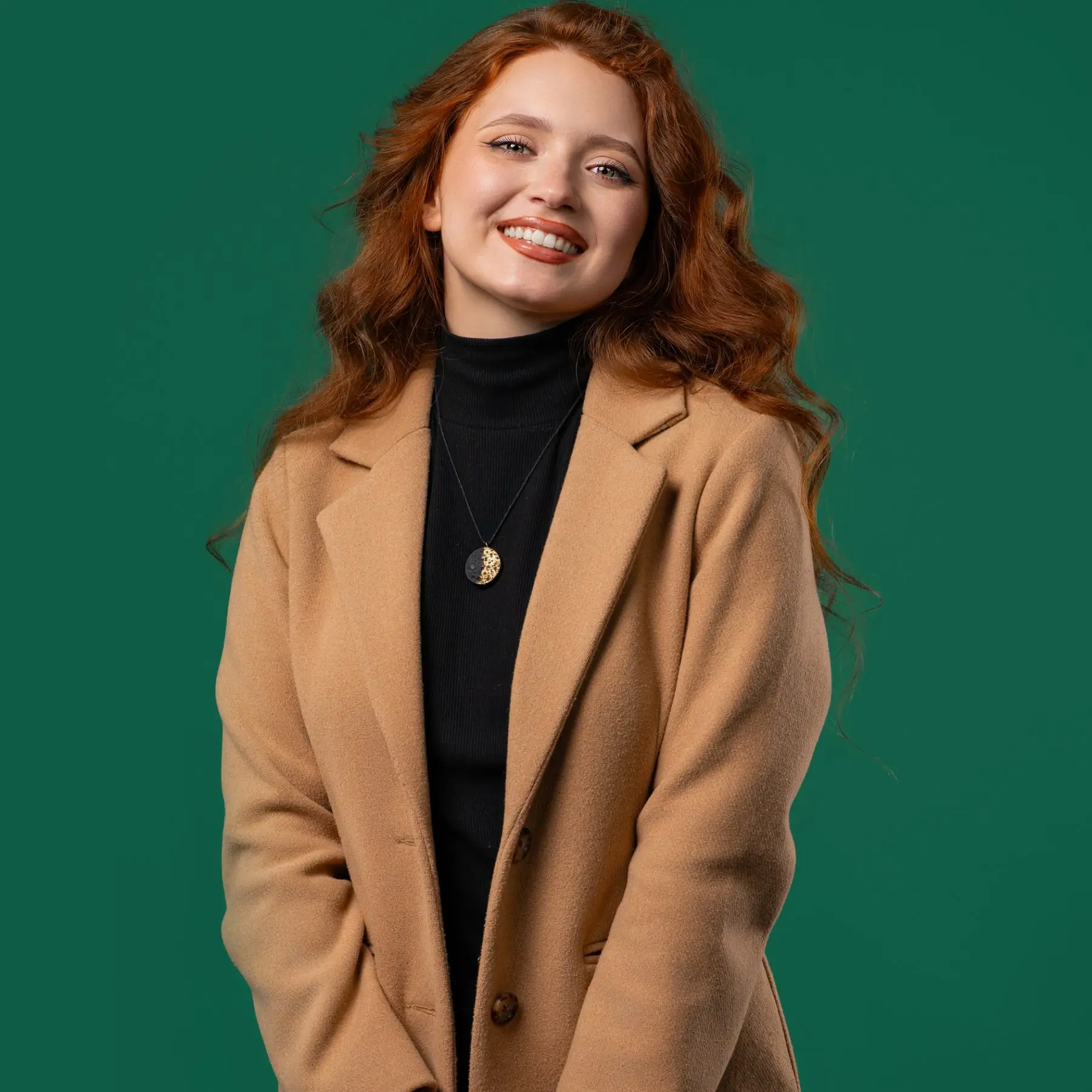 Portrait of Mia Bennett, Content & Publishing Coordinator at GlazeRush, smiling in a studio setting against a green background.