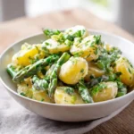 asparagus potato salad with creamy dressing and fresh herbs