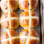 traditional hot cross buns with white crosses and glossy golden tops