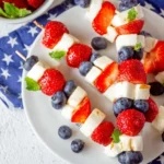 4th of July Fruit Kabobs with strawberries, blueberries, bananas, and patriotic colors