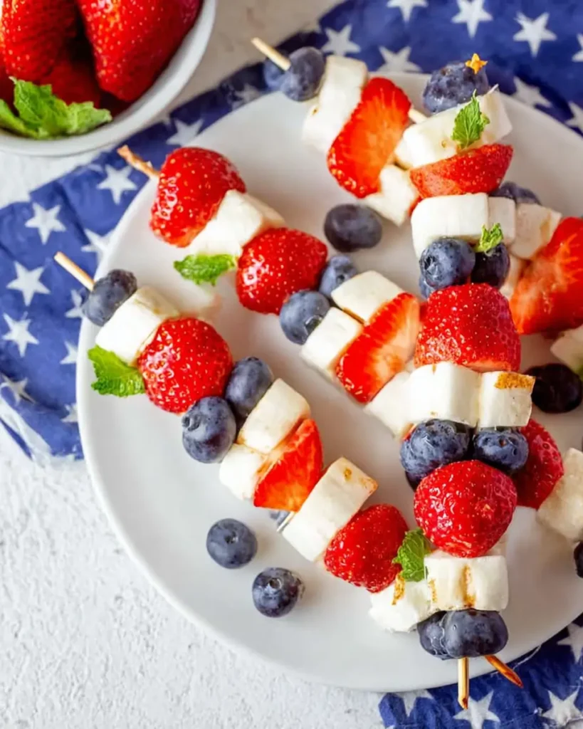 4th of July Fruit Kabobs with strawberries, blueberries, bananas, and patriotic colors