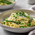 asparagus pea pasta with creamy sauce and fresh green vegetables