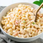 Authentic Hawaiian Macaroni Salad served in a bowl with creamy dressing and elbow macaroni