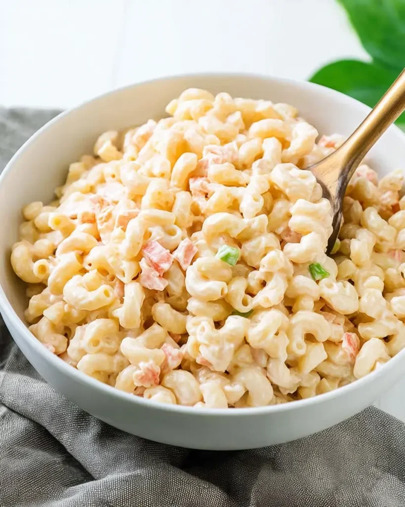 Authentic Hawaiian Macaroni Salad served in a bowl with creamy dressing and elbow macaroni