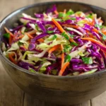 cabbage slaw for tacos with fresh lime and herbs in a bowl