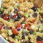 Easy Italian Pasta Salad with rotini pasta, olives, cucumbers, tomatoes, and feta cheese