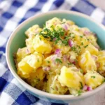 Easy No Mayo Potato Salad served with fresh herbs, red onions, and creamy light dressing