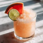frozen paloma recipe with grapefruit slushy drink and citrus garnish