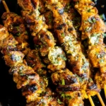 Garlic Parmesan Chicken skewers grilled with herbs and crispy charred seasoning