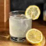 Homemade Lemonade served over ice with fresh lemon slices in a glass