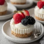No Bake Mini Cheesecakes topped with strawberries, raspberries, blueberries, and blackberries