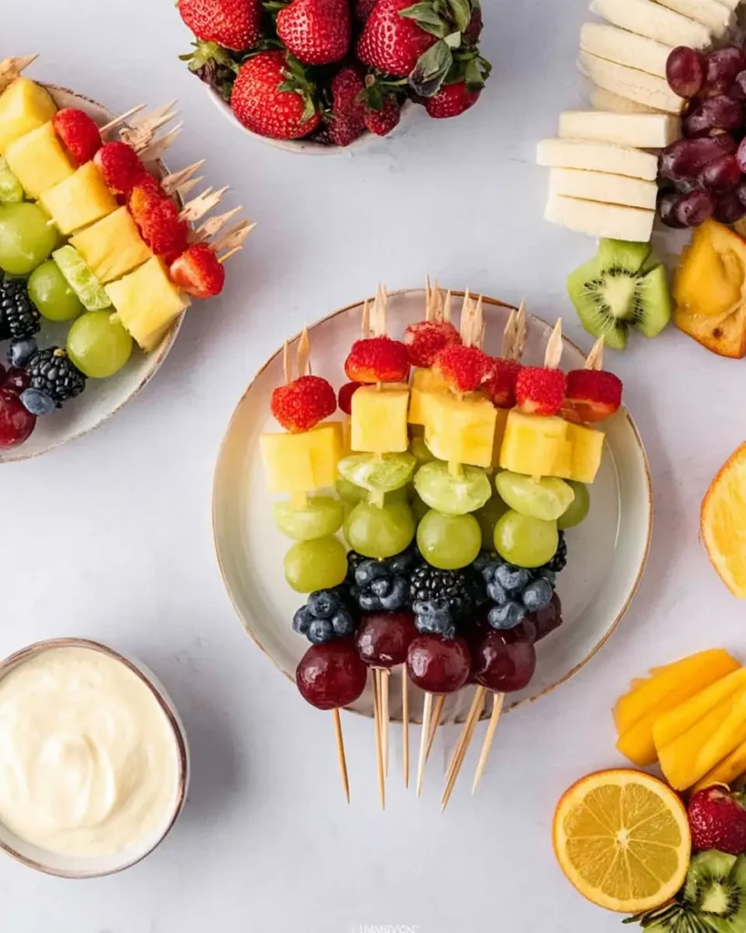 Rainbow-Colored Fruit Kabobs with grapes, pineapple, strawberries, blueberries, and blackberries