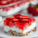 Strawberry Pretzel Salad dessert square with fresh strawberries, creamy filling, and crunchy pretzel crust