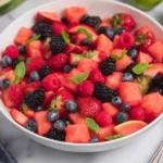 Watermelon Fruit Salad with strawberries, blueberries, blackberries, raspberries, and mint